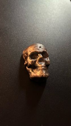 YPS (Yeager’s Poured Silver) 100-gram .999+ fine silver bar, in a skull design.