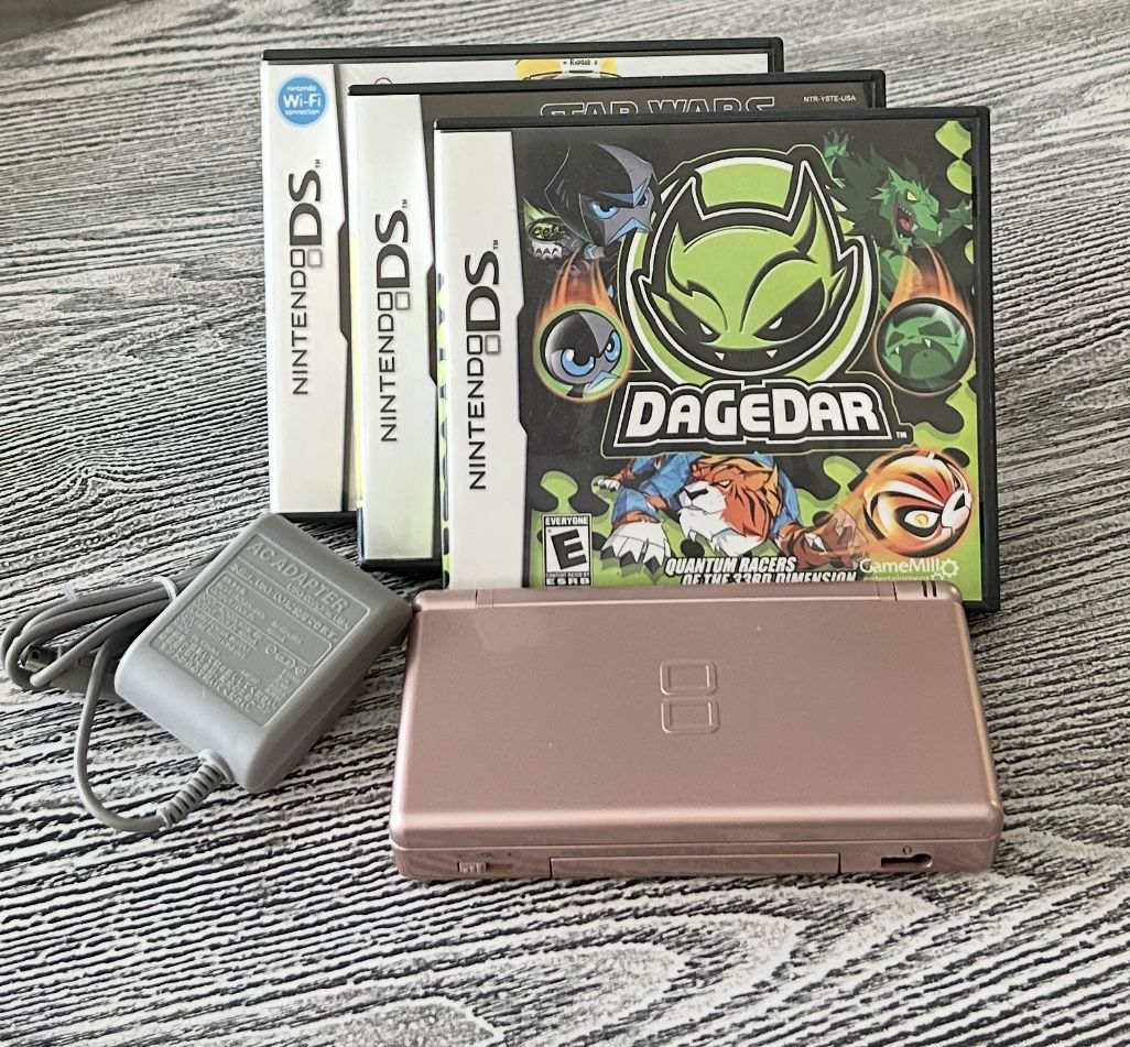 Nintendo DS with 3 games in excellent condition, complete with matching stylus & new charger. $65