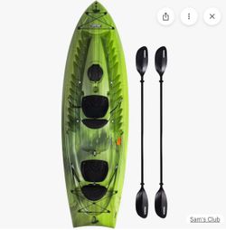 Green Tandem Kayak with oars, roof rack, and life jackets