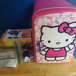 Hello kitty mini fridge really rare good condition pink cute works perfectly can fit 6 sodas and acouple waters