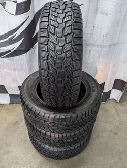 245/60r18 "Near Brand New" Cooper Evolution Winter studded snow tires