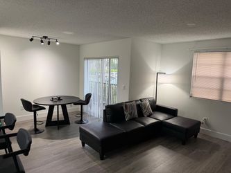 Black sectional sofa with lamp
