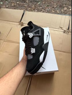 black and white thunder jordan 4’s
