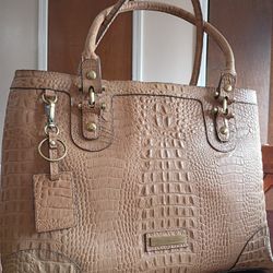 This is an Etienne Aigner vintage crocodile embossed leather satchel shoulder bag purse in a cream or light tan color. 