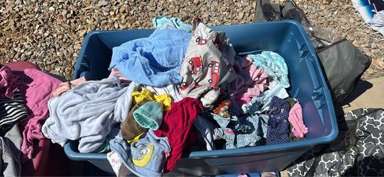 Toys and clothes fill a bag $1