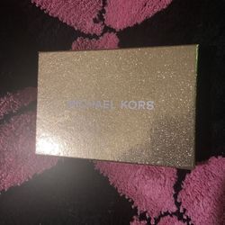 Authentic brand new Michael Kors keychain/card holder with wrist scrap