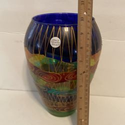 Hand painted face from Ireland with gold trim. 10 inches tall.