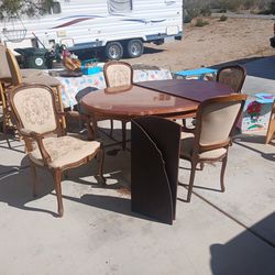 Antique Dining room table and 4 chairs with 2 leafs.  Chairs