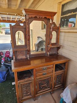 Antique side board with mirror backsplash