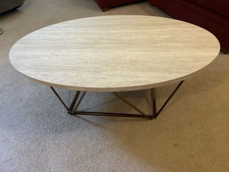 DESIGN BY ASHLEY Tarica 47 in. White/Gold Oval Faux Marble Coffee Table
