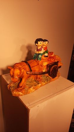 Vintage ceramic bank children riding ox driven wagon