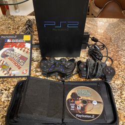 PS2 Game comes with two controllers and a couple games