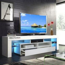 New 63" tv stand in box with LED lights plus remote fits tv up to 75"
