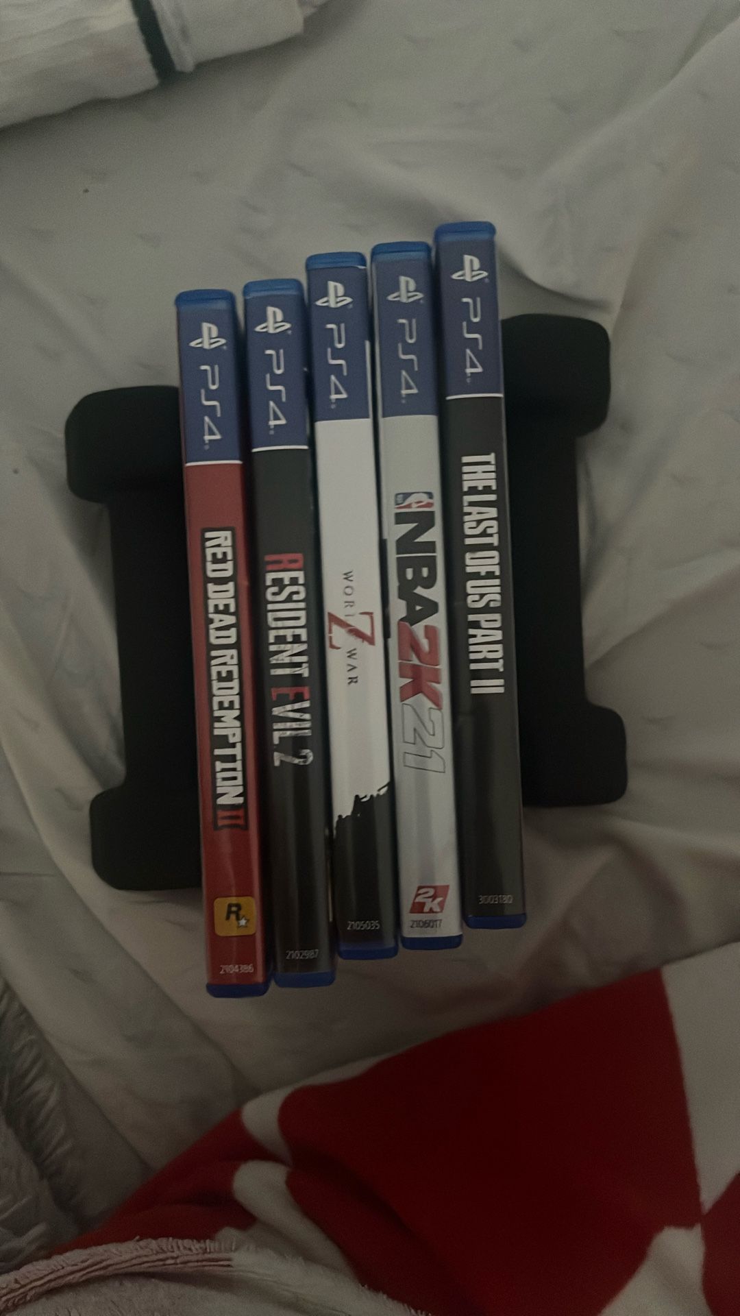 PS4 Game Lot(the Last Of Us, Red Dead Redemption 2,2k21,world War Z, And Resident Evil 2)