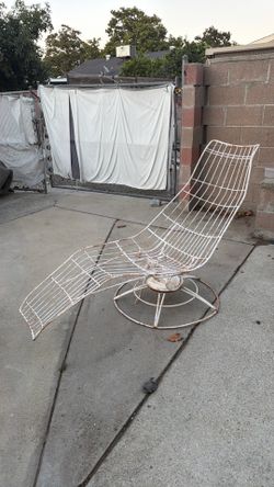 Vintage lounge chair, swivels, and rocks