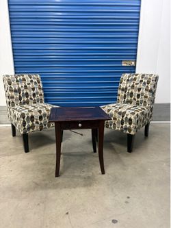 Pair of accent chairs with small coffee table