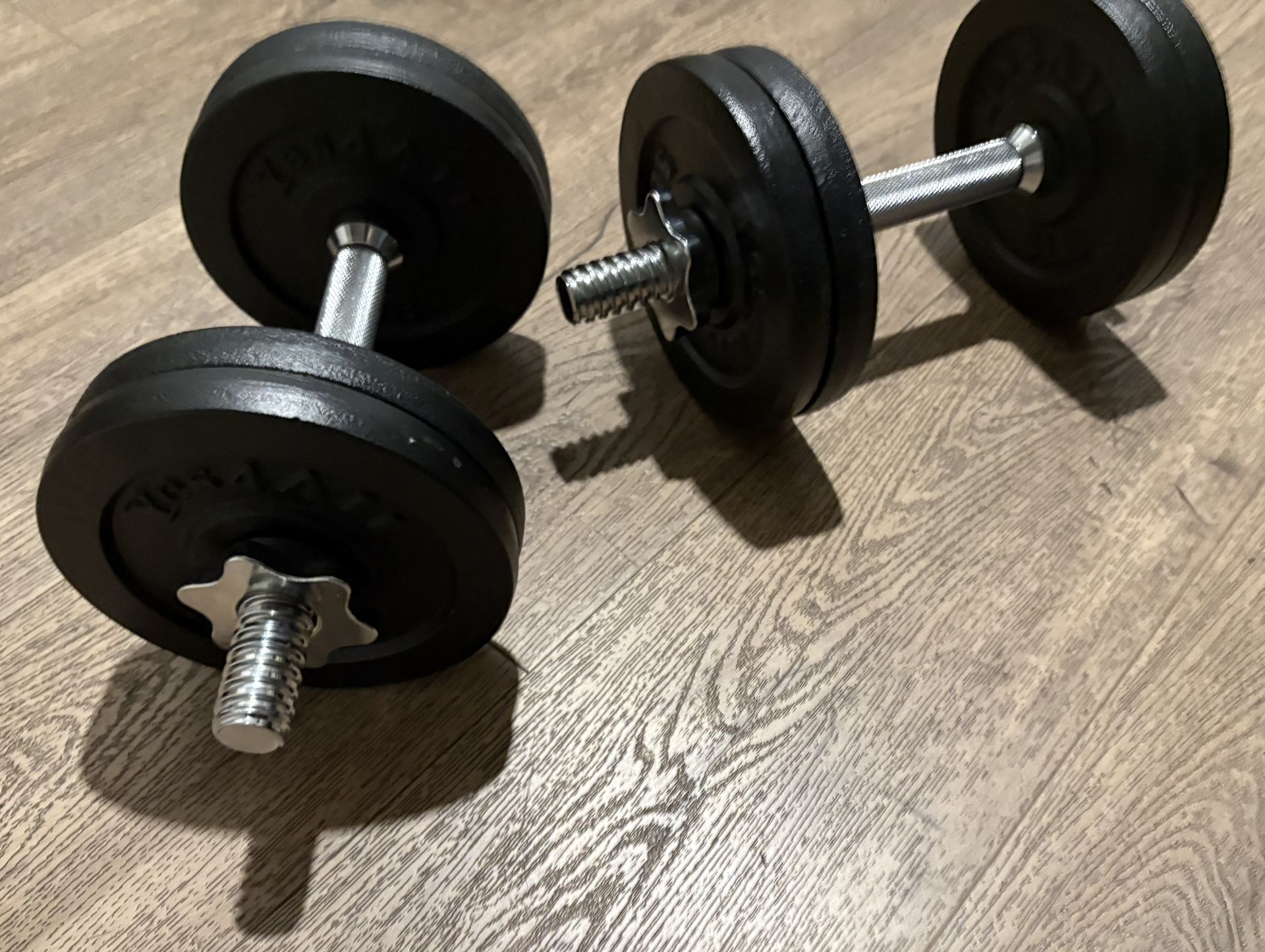 Set Of Cast Iron Adjustable Dumbbells 25 lbs Each.