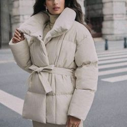 Large, beige bomber jacket