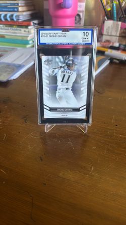 2018 Leaf Draft Shohei Ohtani rookie card (#DY-01) featuring him as a pitcher/outfielder for the Angels.