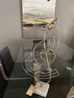 Musical theme metal sculpture on a marble base