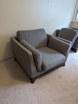 two fabric cushion chairs