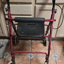 Rolling walker with seat