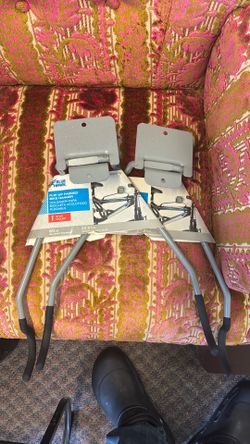 Flip up padded bike hangers