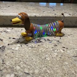Disney Parks Toy Story 4 Light Up Slinky Dog Pixar Flashing Color Stretchy Coils for Sale in Newport Beach CA OfferUp