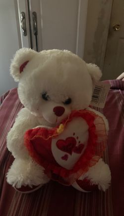 Fluffy bear with a heart for a gift. And it still has a tag and it works perfectly