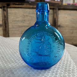 Collectible Glass Embossed Bottle