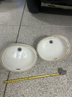 2 sinks with hoses and faucets