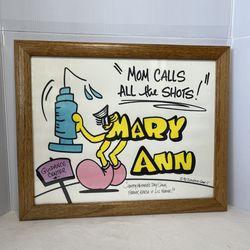framed cartoon print titled "Mary Ann" by artist Larry Garf, featuring the phrase "Mom calls all the shots!".