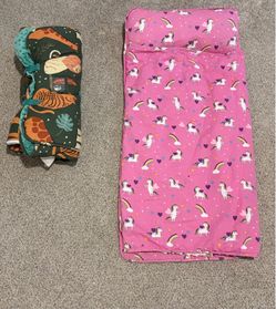 Two children’s roll up nap blankets