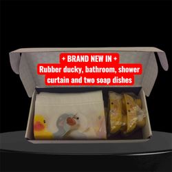 Rubber ducky, shower curtain with two matching soap, dishes