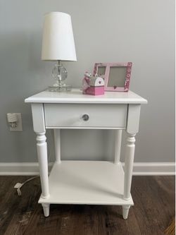 Nighstand with lamp, picture frame And pige Bank