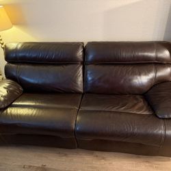 power reclining sofa with power headrest.