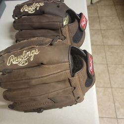 NEW RAWLINGS BASEBALL OR SOFTBALL GLOVE  ALREADY BROKEN $65  EACH GLOVE. FIRM PRICE 