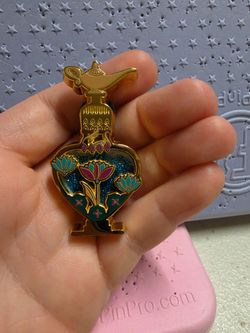 Beautiful perfume pin! From Aladdin