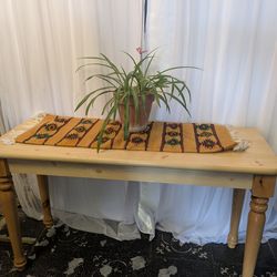 Very nice Blonde wood and tree table measures 27 and 1/2 in high 4 ft. Long 18 in deep