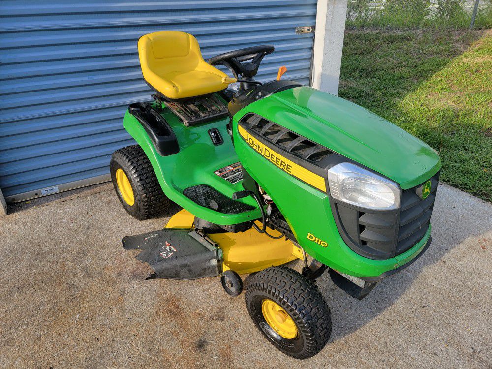 John Deere D110 riding lawn mower, 19hp engine,  42" deck and auto transmission. only 112 hours.