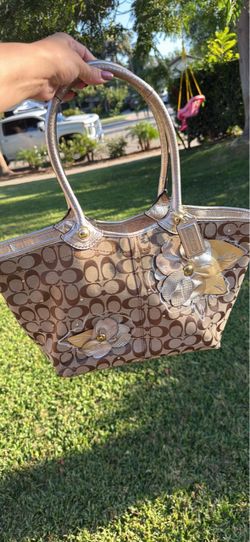 Coach Bleecker Floral Signature Applique F16276 gold and khaki tote featuring standout dimensional leather and suede flower appliqués.
