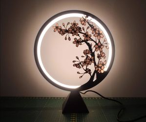 These circular LED silhouette illuminated by a  minimalist and cozy ambient aesthetic.