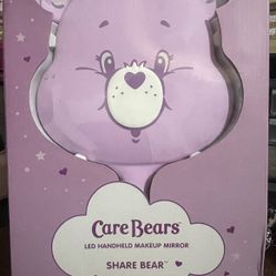 Care Bears x Impressions Vanity LED Handheld Makeup Mirror, specifically the Share Bear edition. 