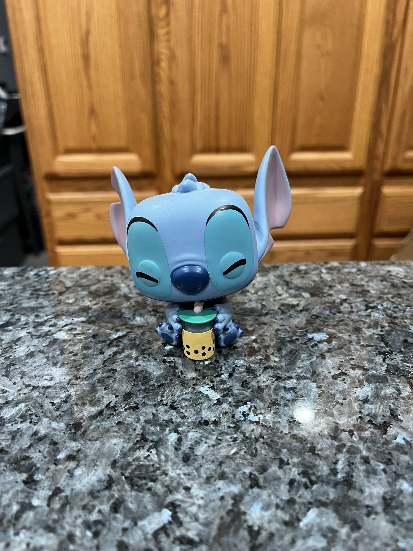 Funko Pop Disney Stitch With Boba Hot Topic Exclusive.  Preowned has been on display in a cabinet with a Disney collection.  