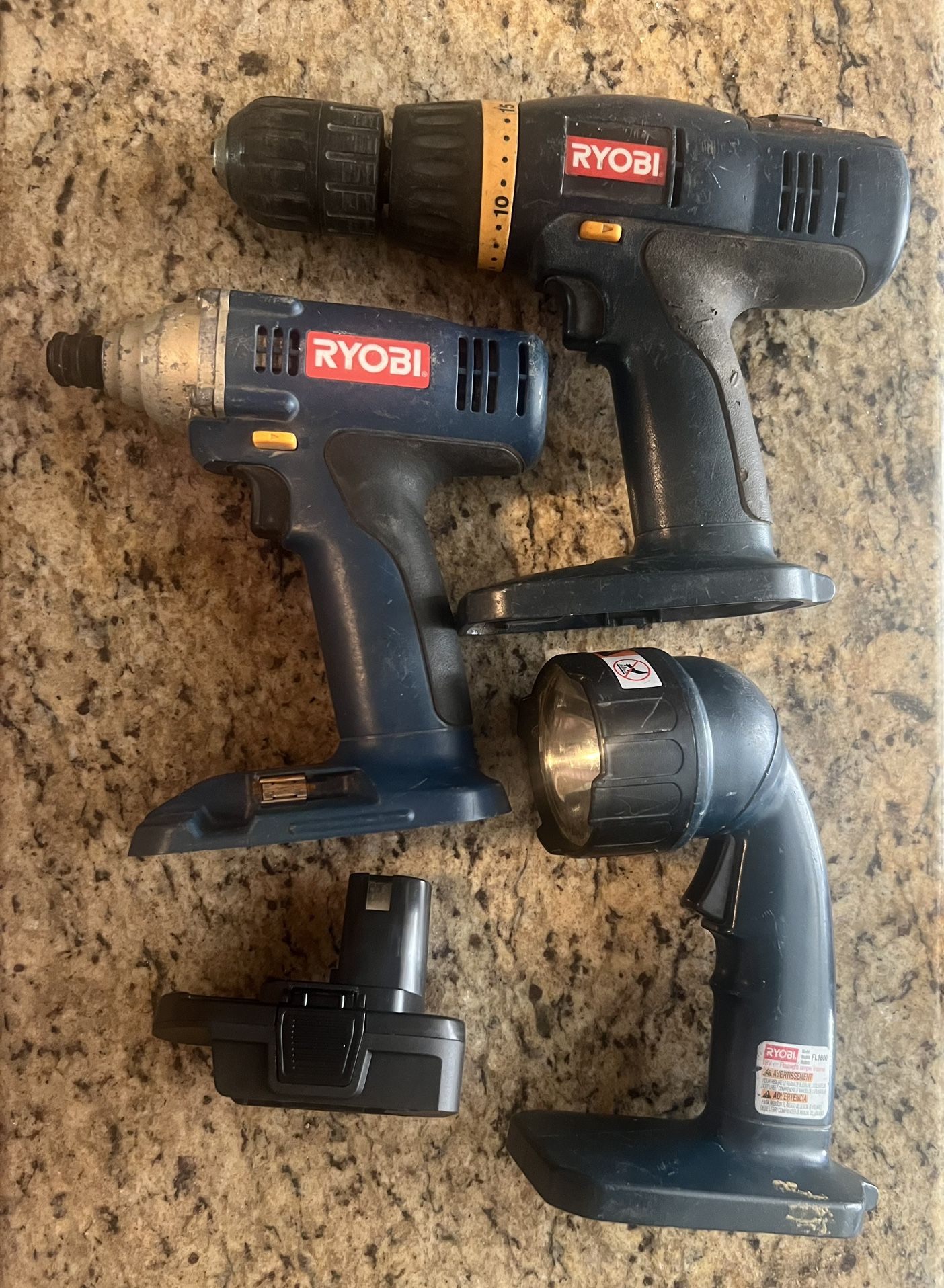 Blue Ryobi 18v tools with battery adapter