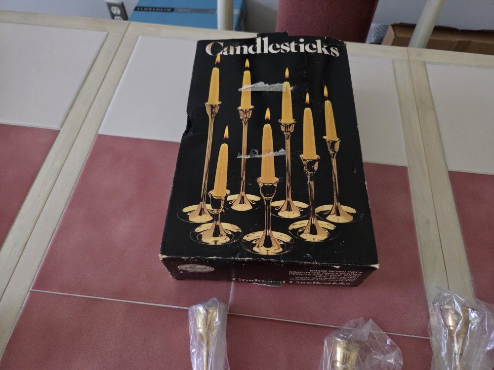 7 CANDLE STICK HOLDERS BRASS NEW IN PACKAGING $25