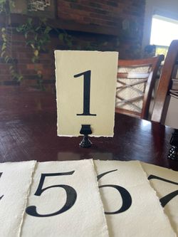 Handmade paper table numbers with metal holders, 1-19 deckled edge