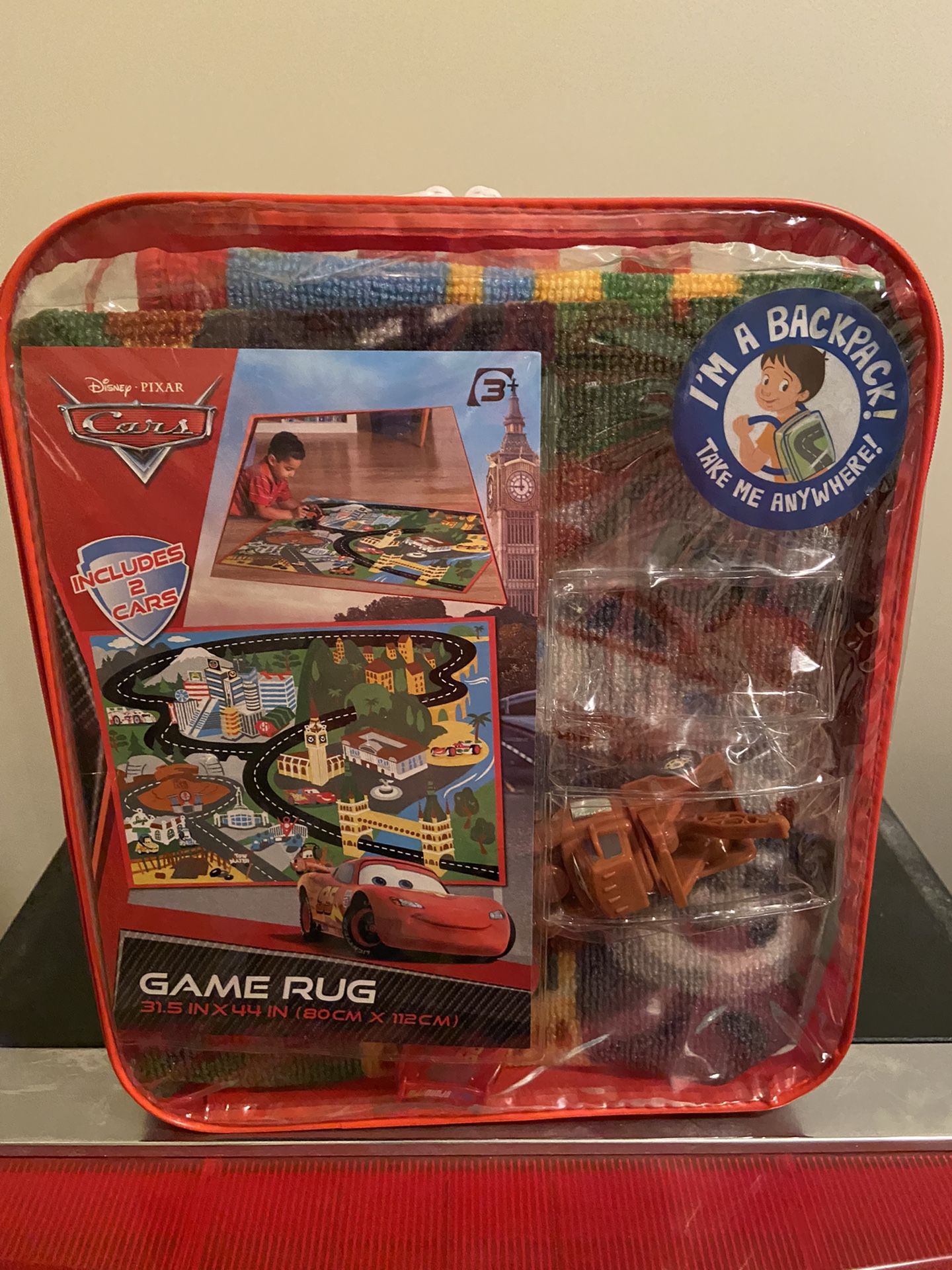 Disney Pixar Cars Game Rug with 2 Cars and in a Reusable Backpack