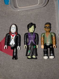 Ozzy , Wife Sharon, & Son Legos Figures. Ozzy is missing one leg.