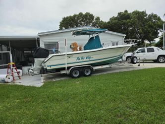 Pursuit Center Console Boat with Trailer